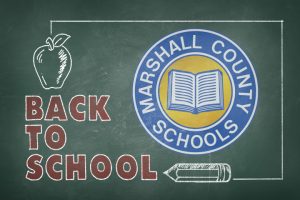 Back to School written in red chalk with the Marshall County Schools logo drawn with chalk.